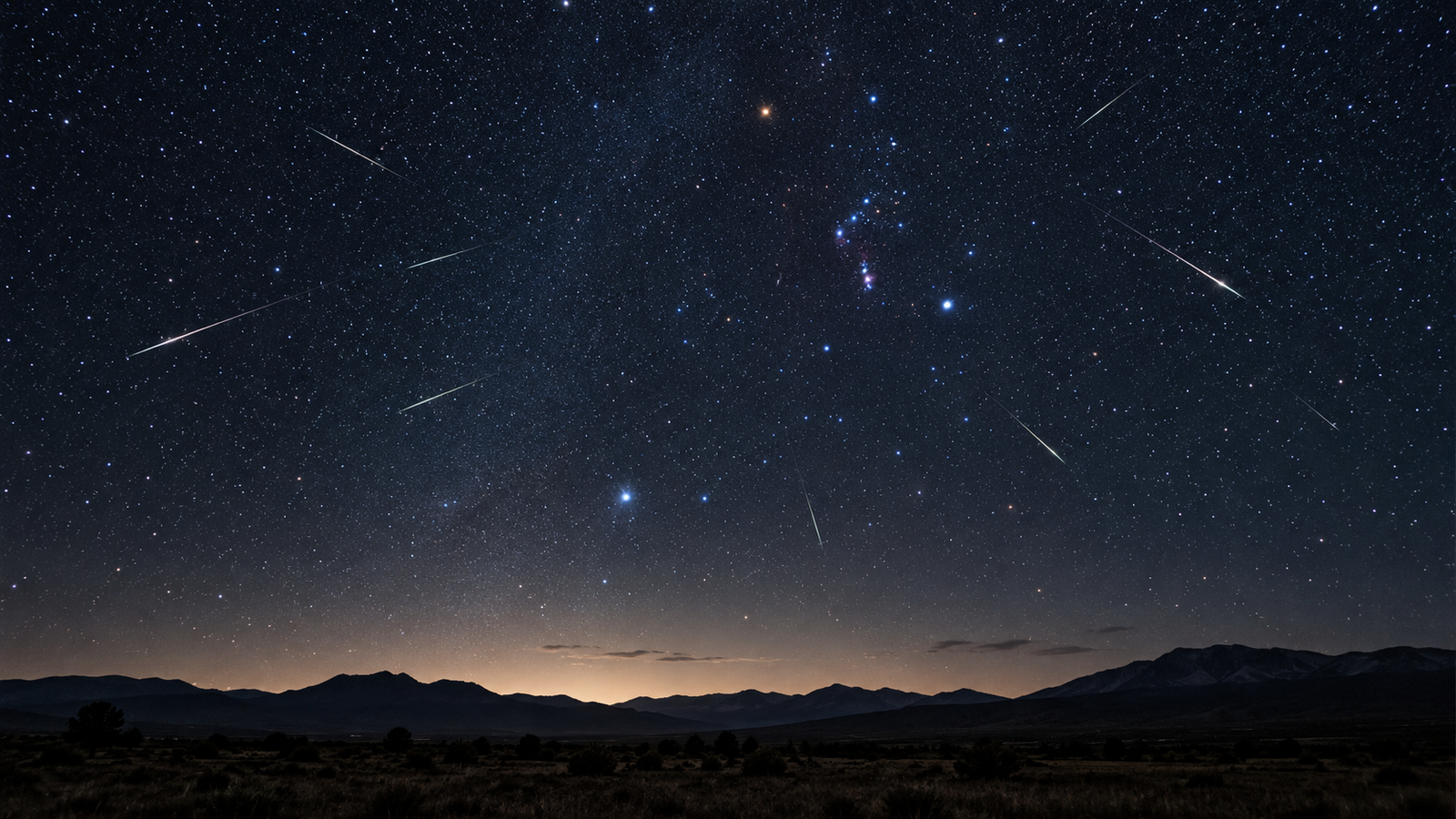 Trazos luminosos de las Oriónidas cruzando la bóveda celeste durante la noche.